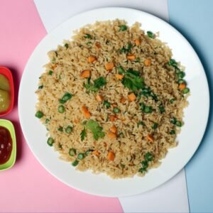 Delicious vegetable fried rice served with green and red sauces, displayed on a colorful background.